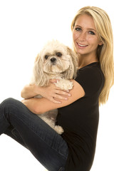 woman black shirt with dog sit side both looking