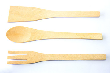 Authentic kitchen wooden utensil of scapula, spoon and fork isol