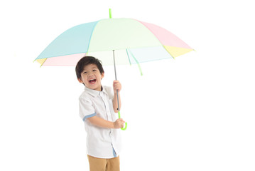 Cute asian boy holding umbrella