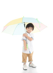 Cute asian boy holding umbrella