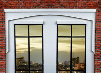 white modern window with brick wall background, city view
