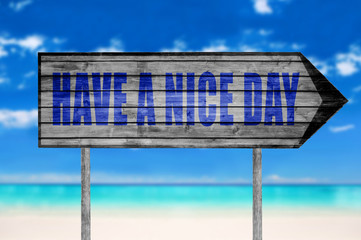 Have a Nice Day wooden sign with on a beach background