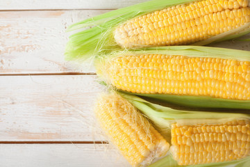 sweetcorn cob with green leaves