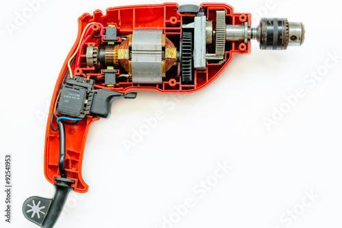 Disembled Electric Drill Isolated On White Background Showing Disembled Electric Drill Isolated On White Background Showing Motor Gears And Switch Inside