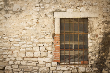 Fototapeta na wymiar stone wall with window