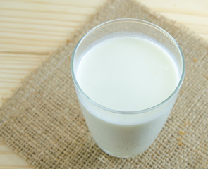 Obraz na płótnie Canvas milk on wood background