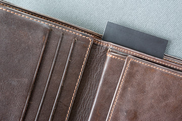 black note paper in brown wallet