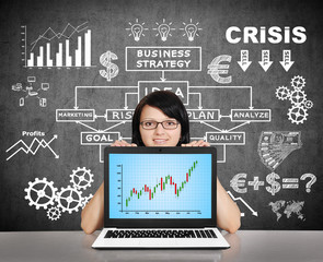 notebook with stock chart  on screen