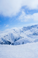 Fototapeta na wymiar Beautiful snow-capped mountains against the blue sky