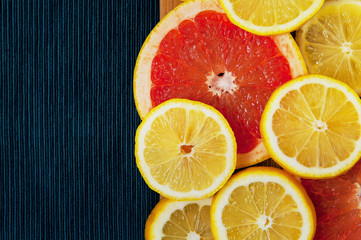 Fototapeta na wymiar Colorful citrus fruit slices. Lemons and grapefruits