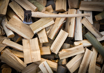 Axe on pile of firewood. Background for your project