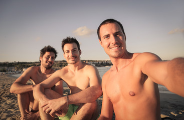 Three friends doing a selfie at the beach