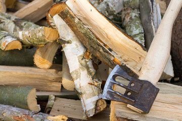 Axe on pile of wood
