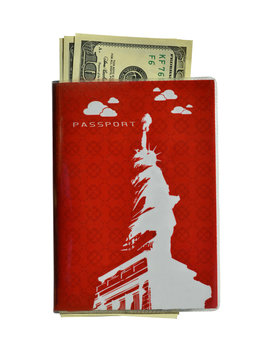 Passport with a picture of the Statue of Liberty on the cover and dollars inside