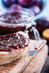 Homemade plum jam with fresh bread