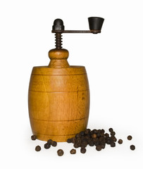 Wooden pepper mill with pepper + clipping path