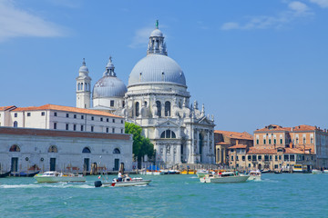Fototapeta na wymiar Grand Canal with historic Roman Catholic church of Saint Mary of Health in Venice, Italy