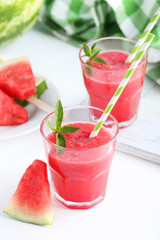 Fresh watermelon juice in the glass on wooden table