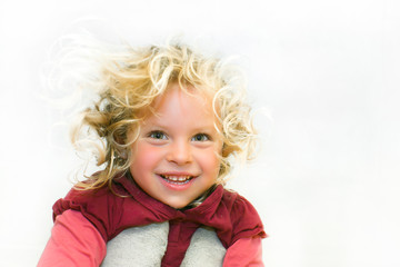 Portrait of a girl. smiles. looking from the top. Age 4 years.