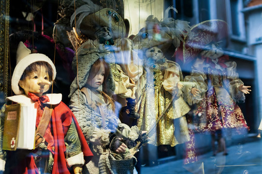 Traditional puppets for sale in souvenir shop. Shop in Venice, Italy