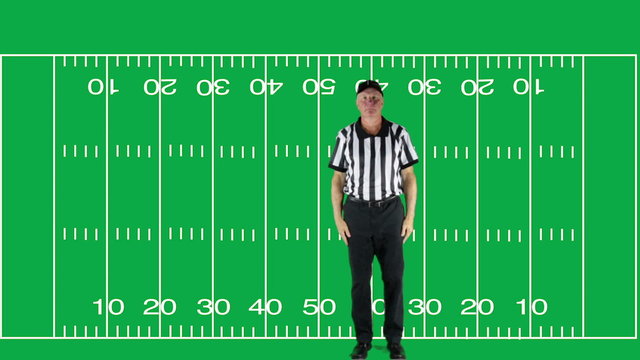 Man dressed as a football official signaling Touchdown.