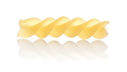 One macro shot of fusilli pasta isolated on white