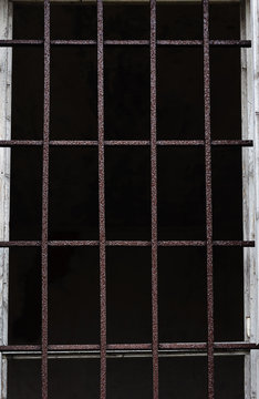 Old window with iron bars