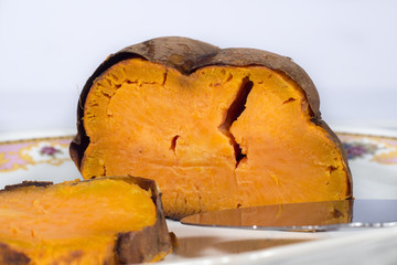 Roasted sweet potato in ceramic tray