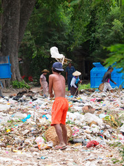 Plastic pollution — environmental rubbish problem in Myanmar: Volunteer cleaning the plastic...