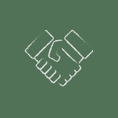 Handshake icon drawn in chalk.