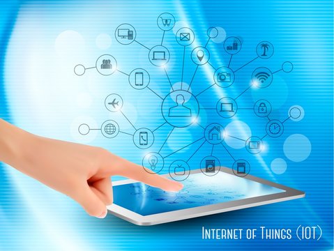 Internet of Things concept (IoT). Hand holding a tablet or smart