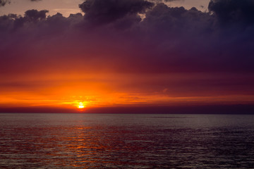 beautiful landscape with sunset over sea with dramatic sky