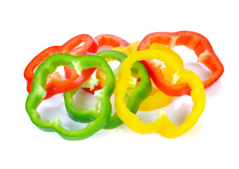 Sliced red yellow green pepper isolated on white