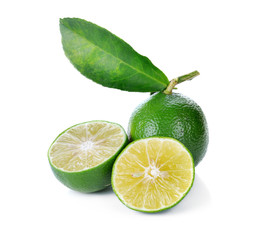 lime and leaves on white background