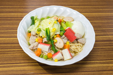 Noodles with vegetables and meat to eat healthy on wood table, Thai food