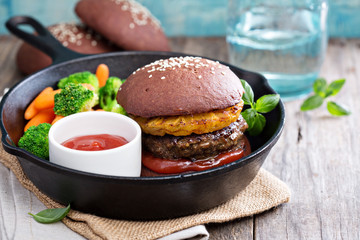 Beef burgers with pineapples and chocolate buns