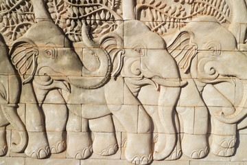 elephants concrete carving on the wall
