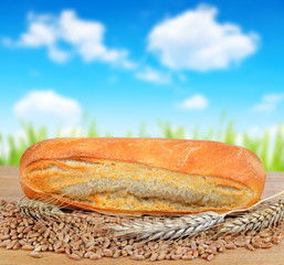 Freshly baked baguette with wheat