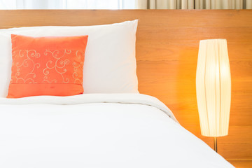 Beautiful luxury bedroom interior with orange pillow decoration