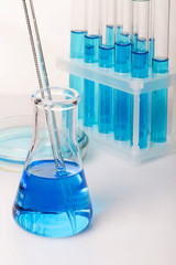 Laboratory equipment with blue liquid (water)
