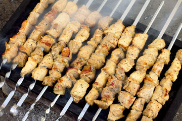 Pork with kiwi, cooking on the grill