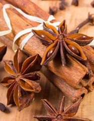Star anise, cinnamon sticks and cloves on wooden table, seasoning for cooking