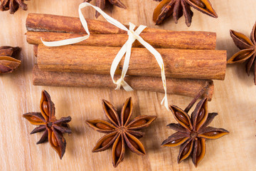 Star anise and cinnamon sticks on wooden table, seasoning for cooking