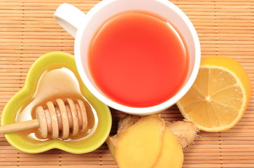 Cup of healthy tea with honey ginger and lemon
