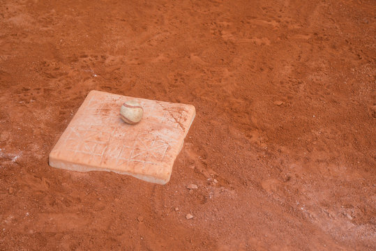 baseball and base on baseball field