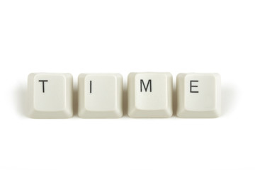 time from scattered keyboard keys on white