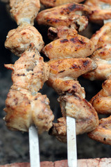 Chicken on the grill to cook