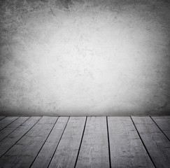 Grunge wall and wood paneled floor, interior of a room.