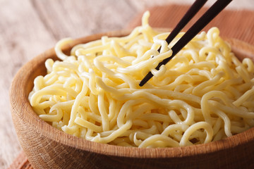 Asian Food: Ramen noodles macro in a wooden bowl. Horizontal
