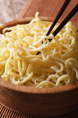 Asian Food: Ramen noodles macro in a wooden bowl. vertical
